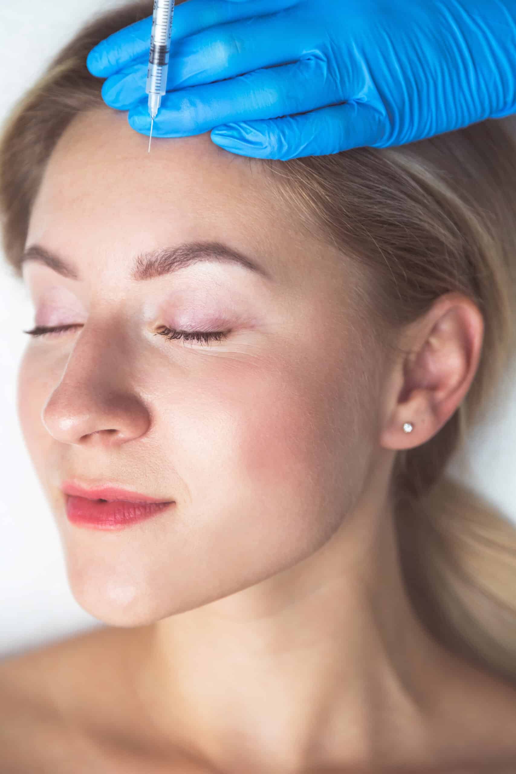 Rejuvenating facial injections procedure for tightening and smoothing wrinkles on the face skin